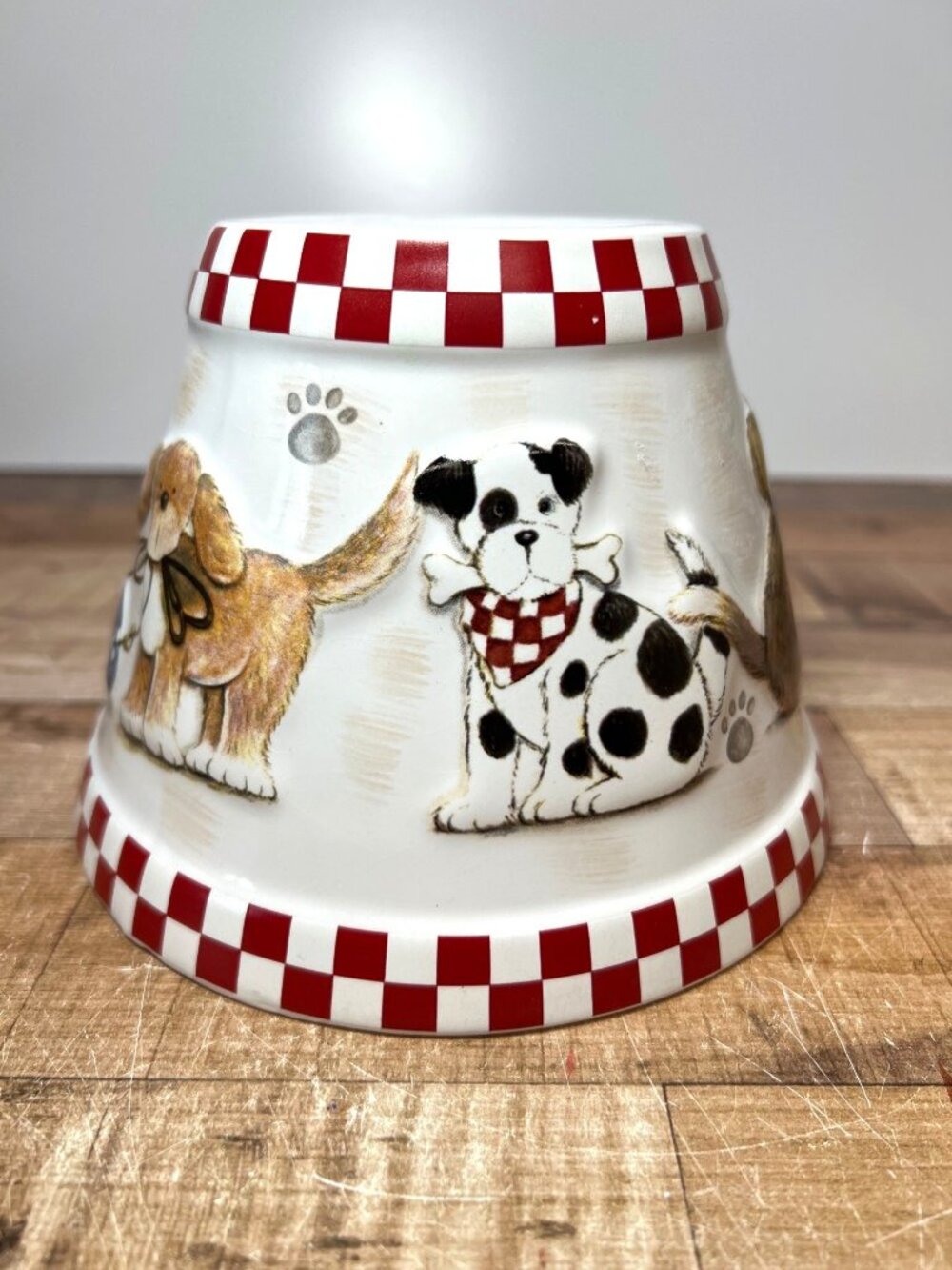 Deb Strain Ceramic Dog-Themed Candle Topper With Red Checkered Design
